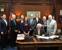 Steve Beshear signs a law that stops unexpected costs for a screening colonoscopy